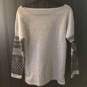 Woman’s small grey fleece top with tribal print